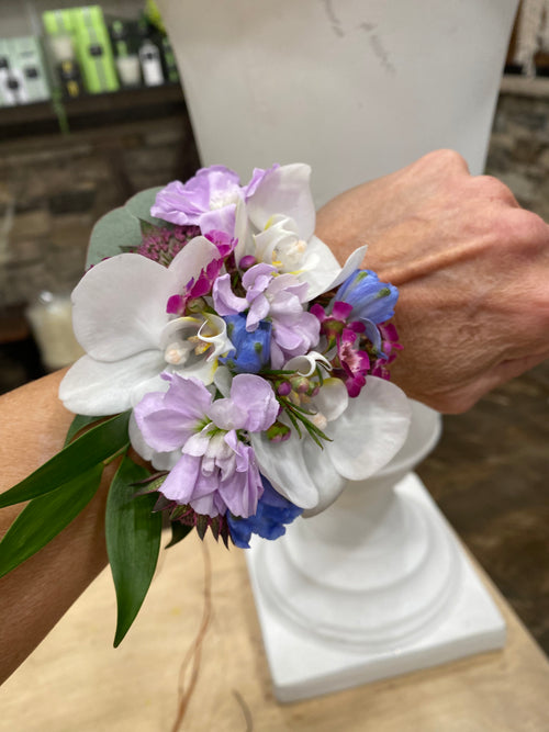 Orchid wrist corsage with accent flowers